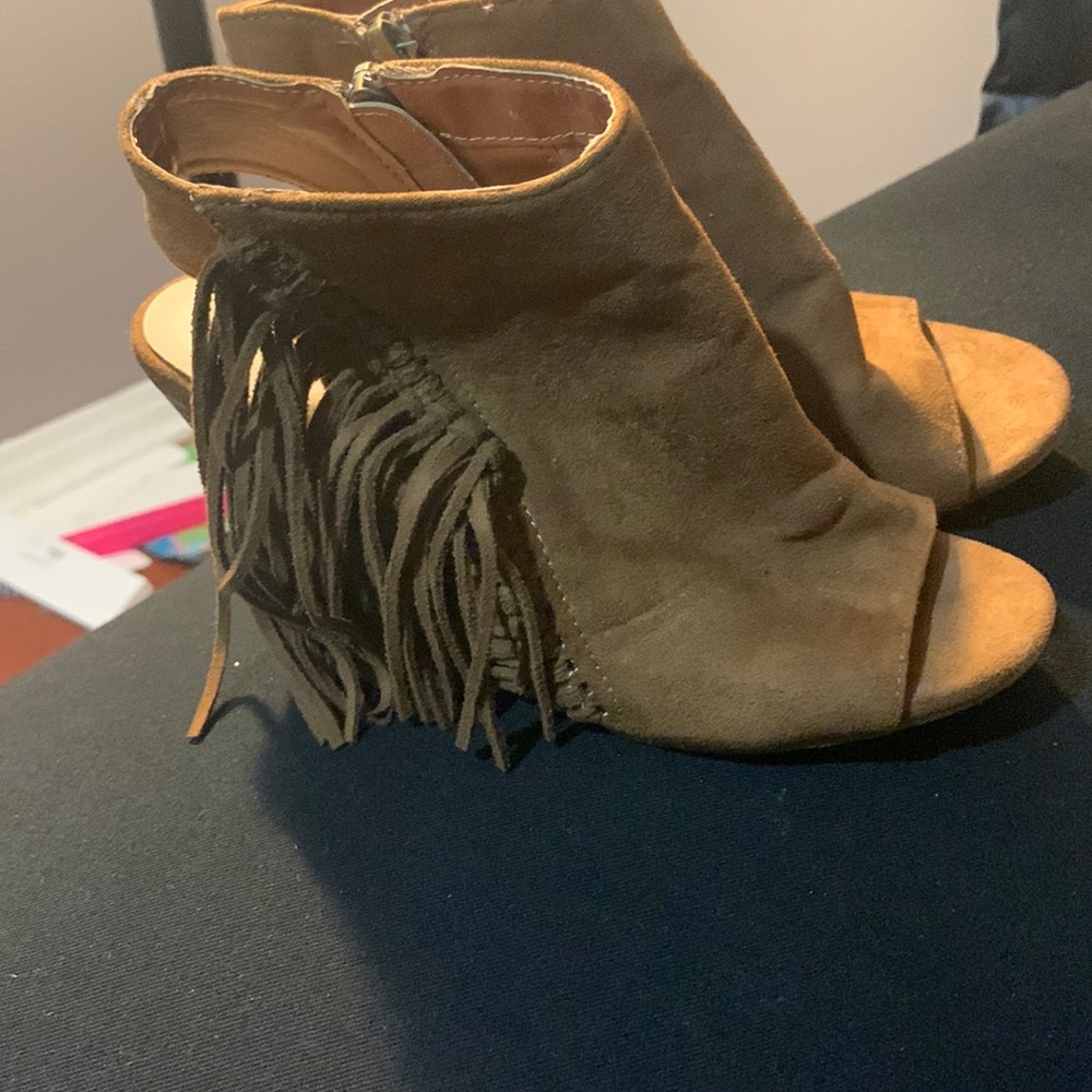 Brown Coconut sandals with tassels on the side